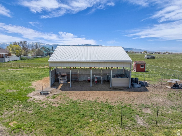 1563 Bryan Rd, Erda, UT 84074 - view of vehicle parking with a detached carport, fence, and exterior structure