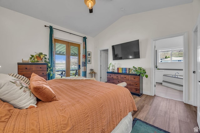 1563 Bryan Rd, Erda, UT 84074 - bedroom with wood finished floors, access to outside, baseboards, ensuite bath, and lofted ceiling
