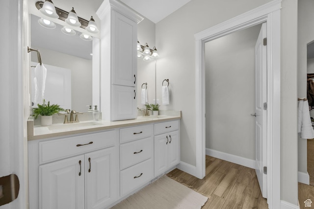 2364 N 2400 W, Farr West, UT 84404 - bathroom with baseboards, wood finished floors, a sink, and double vanity