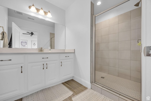 2364 N 2400 W, Farr West, UT 84404 - full bathroom featuring tiled shower, visible vents, wood finished floors, ceiling fan, and vanity