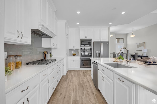 2364 N 2400 W, Farr West, UT 84404 - kitchen featuring stainless steel appliances, a sink, light countertops, and light wood-style floors