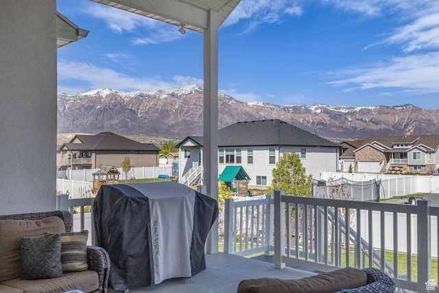 2364 N 2400 W, Farr West, UT 84404 - wooden deck featuring grilling area, a mountain view, a residential view, and a fenced backyard