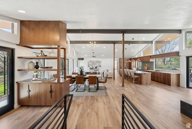dining space featuring a chandelier and light wood-style flooring
