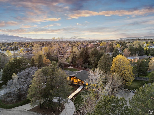 aerial view at dusk featuring a mountain view
