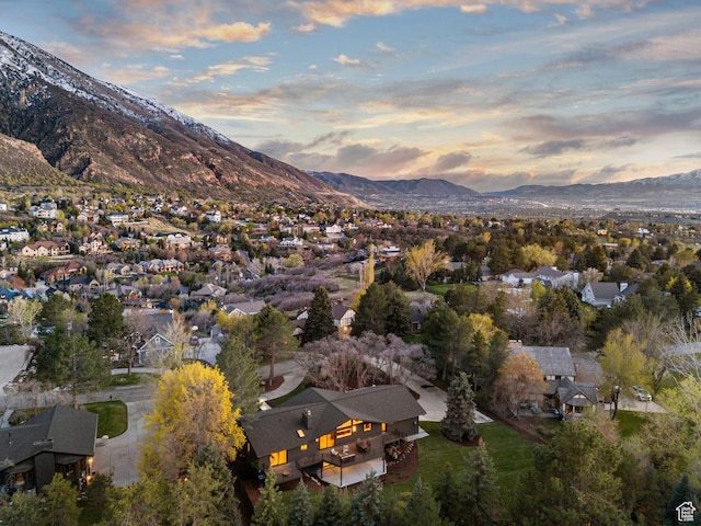 aerial view at dusk with a residential view and a mountain view
