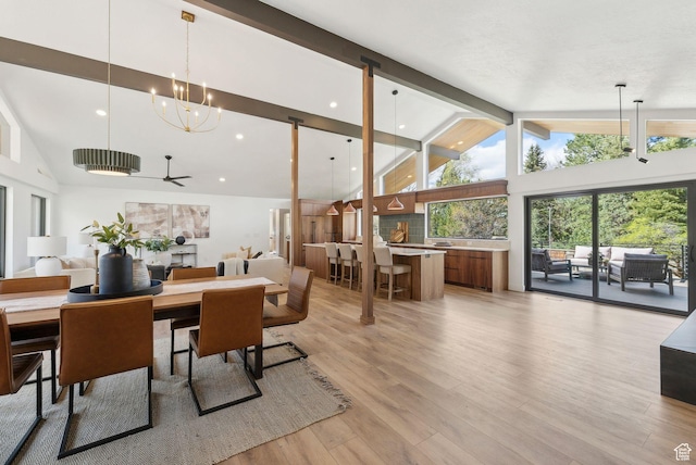 dining space with light wood-style flooring, beam ceiling, recessed lighting, a chandelier, and high vaulted ceiling