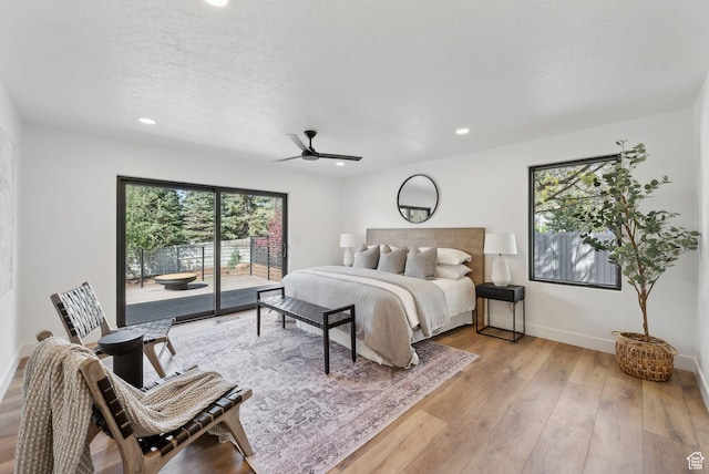 bedroom featuring light wood finished floors, baseboards, access to outside, and recessed lighting
