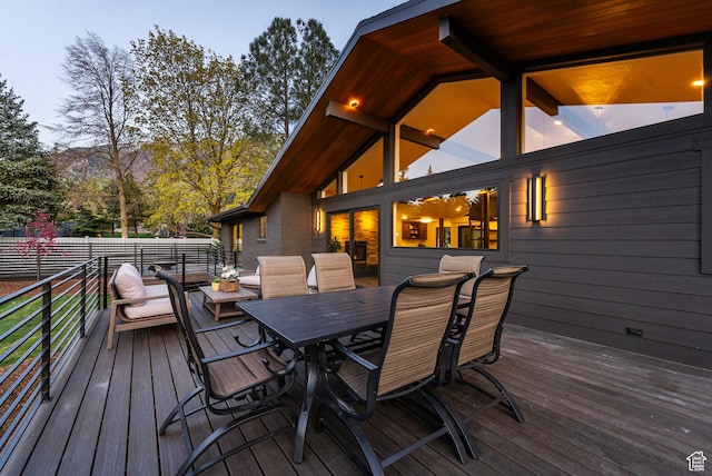 deck with outdoor dining area