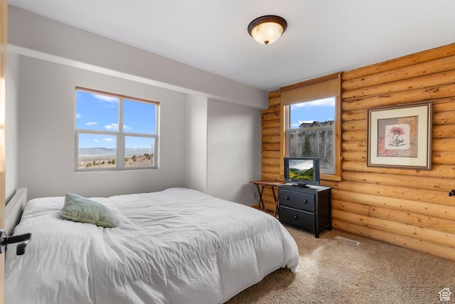 2292 S Aspen Loop, Garden City, UT 84028 - carpeted bedroom with log walls