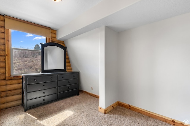 2292 S Aspen Loop, Garden City, UT 84028 - bedroom with carpet, log walls, and baseboards