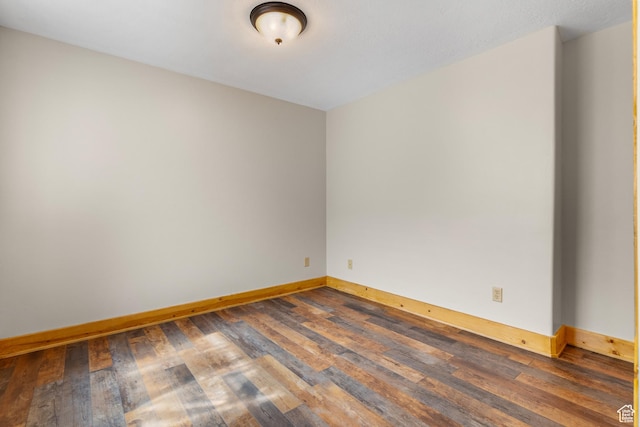 2292 S Aspen Loop, Garden City, UT 84028 - unfurnished room featuring baseboards and dark wood-style floors