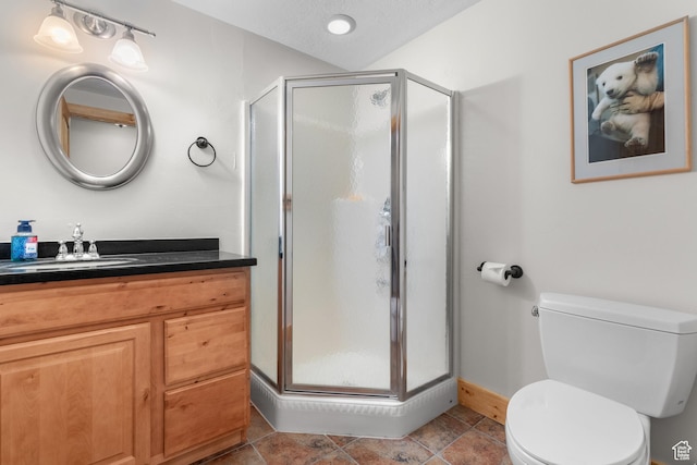 2292 S Aspen Loop, Garden City, UT 84028 - full bath featuring baseboards, vanity, toilet, and a stall shower