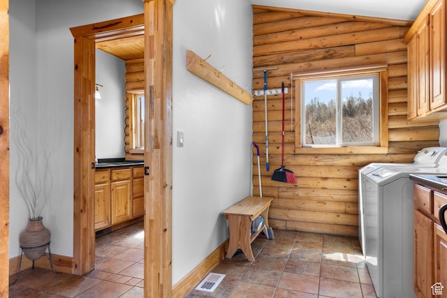 2292 S Aspen Loop, Garden City, UT 84028 - laundry room with cabinet space, baseboards, and rustic walls