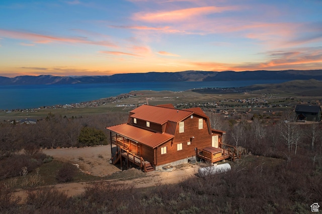 2292 S Aspen Loop, Garden City, UT 84028 - aerial view at dusk featuring a mountain view