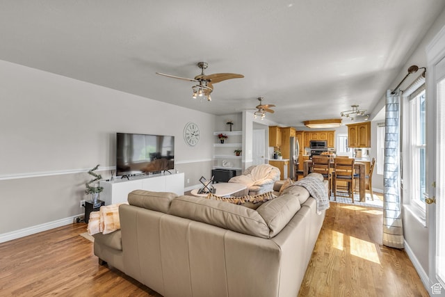 305 E 3700 N, North Ogden, UT 84414 - living area featuring baseboards, light wood-style floors, and ceiling fan