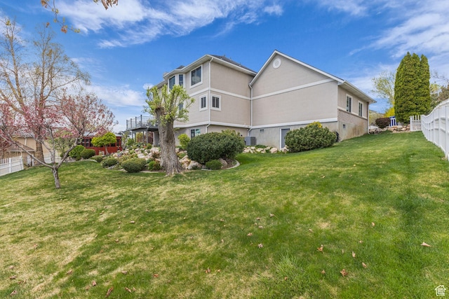 305 E 3700 N, North Ogden, UT 84414 - view of side of property with stucco siding, fence, and a yard