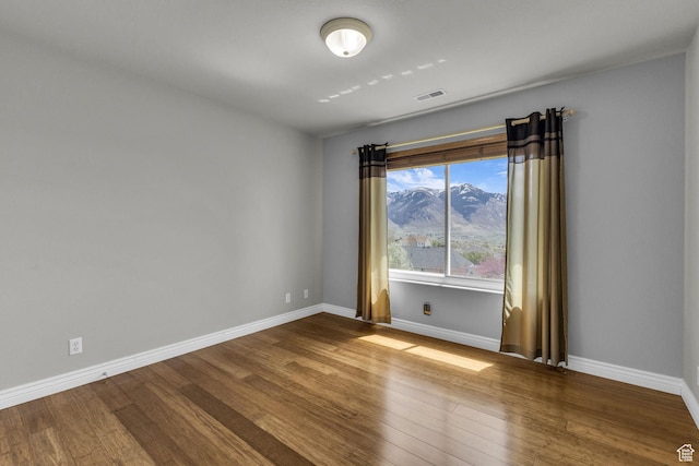 305 E 3700 N, North Ogden, UT 84414 - unfurnished room with baseboards, wood finished floors, and visible vents
