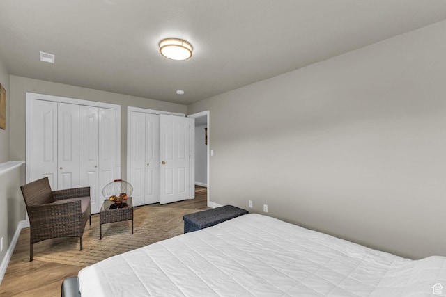 305 E 3700 N, North Ogden, UT 84414 - bedroom featuring baseboards, wood finished floors, and multiple closets