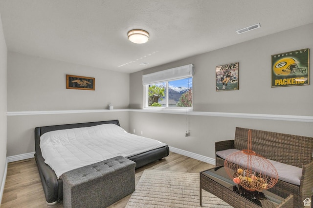 305 E 3700 N, North Ogden, UT 84414 - bedroom with baseboards, wood finished floors, and visible vents