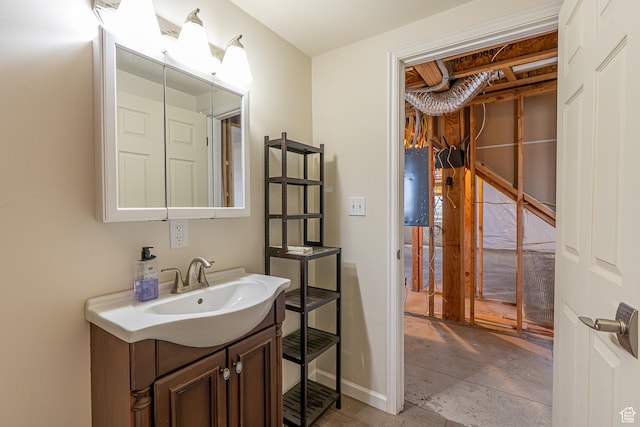 bathroom with baseboards and vanity