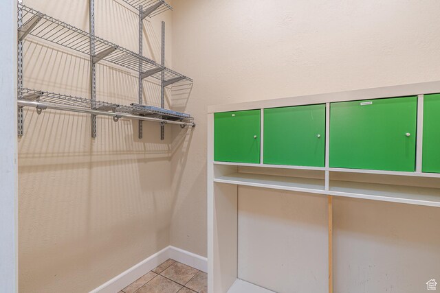 spacious closet featuring tile patterned floors