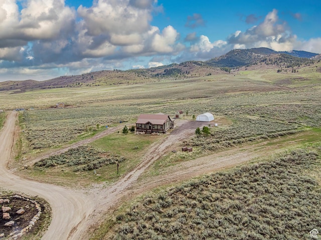bird's eye view featuring a rural view and a mountain view