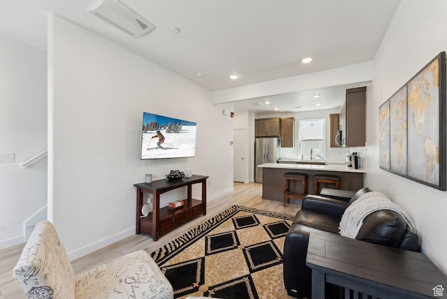 306 W Azure Sky Ln, Salt Lake City, UT 84103 - living room with recessed lighting, visible vents, light wood finished floors, and baseboards