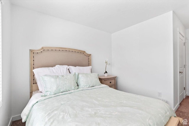 carpeted bedroom with baseboards