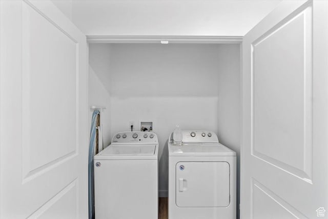 clothes washing area with washing machine and dryer and laundry area