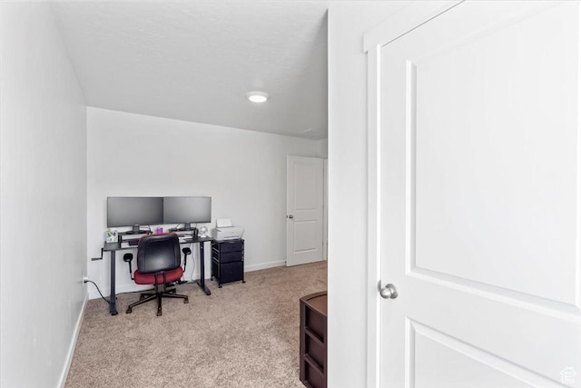 office featuring baseboards and carpet flooring