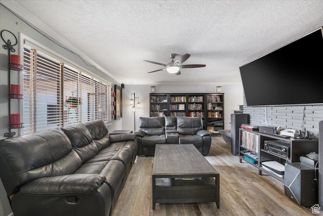 498 E 3000 N, North Ogden, UT 84414 - living room featuring ceiling fan, ornamental molding, wood finished floors, and a textured ceiling