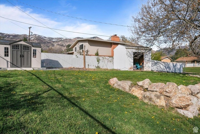 498 E 3000 N, North Ogden, UT 84414 - view of yard with an outdoor structure, fence, and a shed