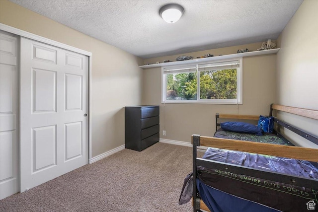 498 E 3000 N, North Ogden, UT 84414 - bedroom with carpet floors, a textured ceiling, and baseboards