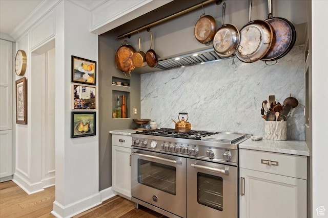 1904 E Yalecrest Ave S, Salt Lake City, UT 84108 - kitchen featuring tasteful backsplash, light countertops, double oven range, and light wood-style flooring