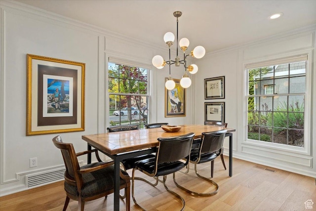 1904 E Yalecrest Ave S, Salt Lake City, UT 84108 - dining area featuring plenty of natural light, visible vents, light wood-style floors, crown molding, and a chandelier