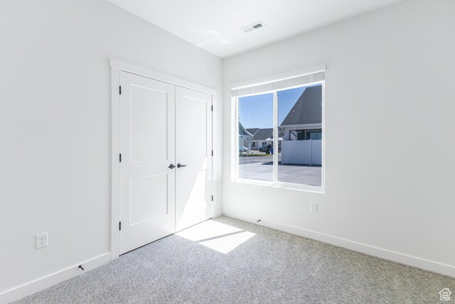 4 S 3830 W Unit 418, West Point, UT 84015 - unfurnished bedroom with carpet and a closet