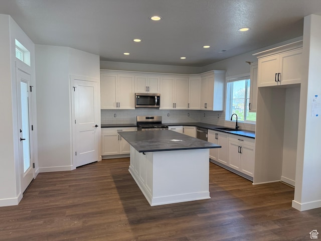 4 S 3830 W Unit 418, West Point, UT 84015 - kitchen with stainless steel appliances, dark countertops, a sink, recessed lighting, and baseboards