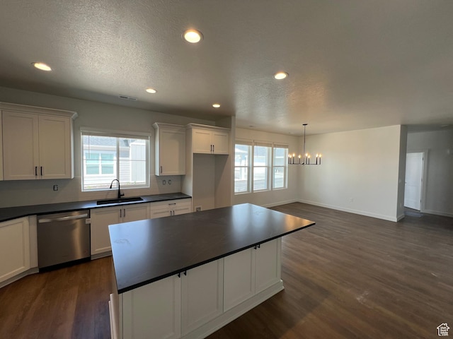 4 S 3830 W Unit 418, West Point, UT 84015 - kitchen with dishwasher, dark countertops, a chandelier, a sink, and white cabinets