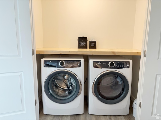 1734 E Muss Dr, Eagle Mountain, UT 84005 - washroom with wood finished floors, washer and dryer, and laundry area