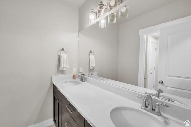 1153 E 2850 N, North Ogden, UT 84414 - bathroom featuring baseboards, a sink, and double vanity