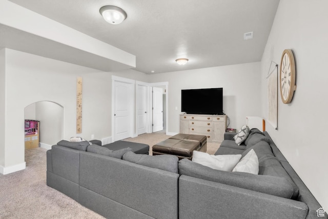 1153 E 2850 N, North Ogden, UT 84414 - carpeted living room with visible vents, baseboards, and arched walkways