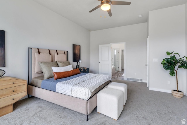carpeted bedroom with baseboards, visible vents, and ceiling fan