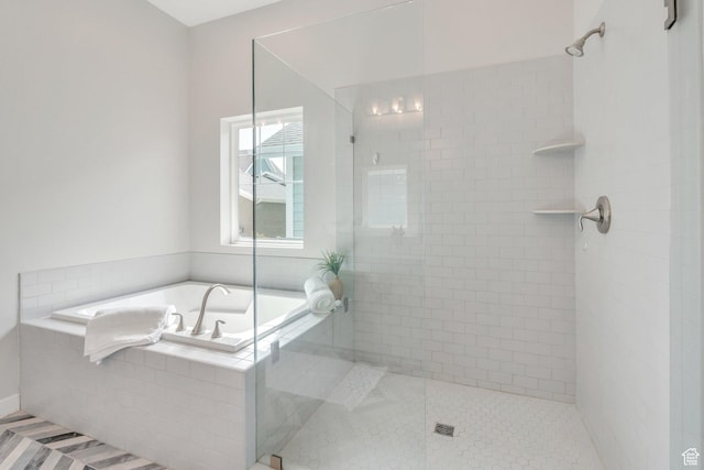 full bathroom featuring a garden tub, tile patterned flooring, and a shower stall