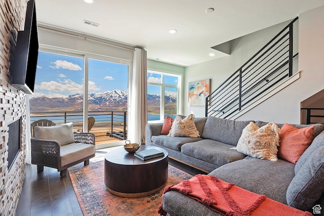 801 E Klaim Dr N, Hideout, UT 84036 - living room featuring a large fireplace, recessed lighting, wood finished floors, and stairs