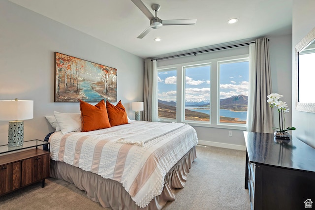 801 E Klaim Dr N, Hideout, UT 84036 - bedroom featuring light colored carpet, multiple windows, recessed lighting, baseboards, and ceiling fan