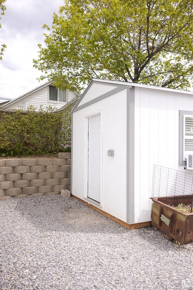 view of shed with fence