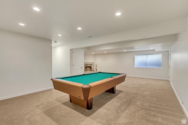recreation room featuring baseboards, light carpet, and recessed lighting