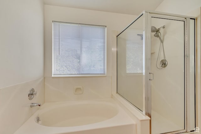 full bath with a garden tub and a stall shower