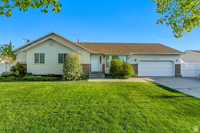 single story home with brick siding, a front yard, concrete driveway, and a garage