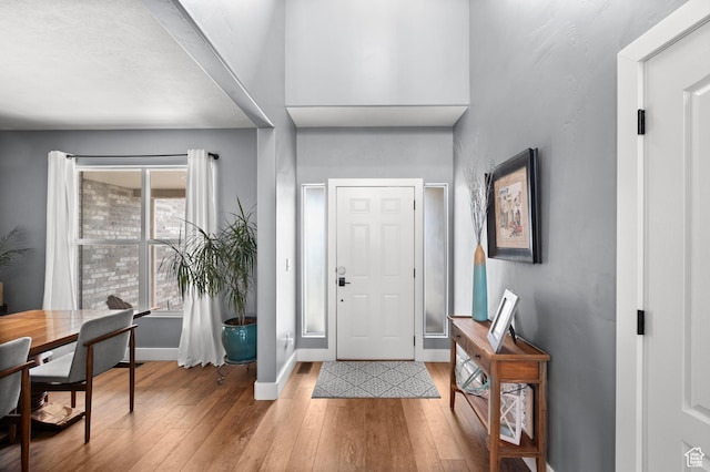 322 Flour Mill Dr, Kaysville, UT 84037 - foyer entrance featuring baseboards and wood finished floors